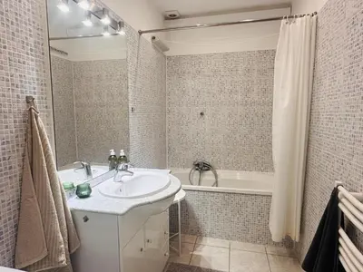 a bathroom with a sink and a bath tub at Bright one bedroom apartment in the center of Cannes13 minutes walk to the Palais des Festivals - 2290 in Cannes