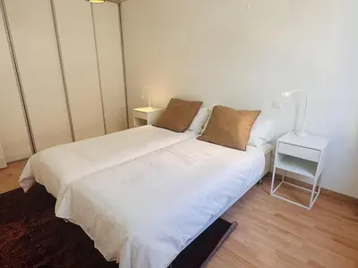 a bedroom with two beds and a side table at Bright one bedroom apartment in the center of Cannes13 minutes walk to the Palais des Festivals - 2290 in Cannes