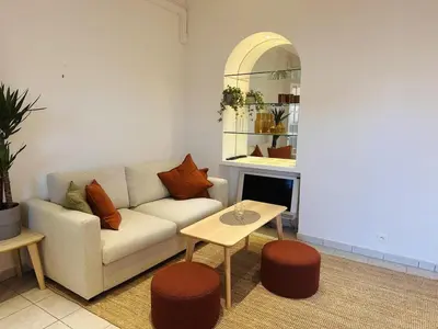 a living room with a couch and a table at Bright one bedroom apartment in the center of Cannes13 minutes walk to the Palais des Festivals - 2290 in Cannes