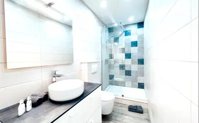 a bathroom with a sink and a toilet and a shower at Studio moderne et calme en plein centre in Cannes