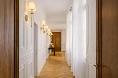 a bedroom with a large bed and a window at Le Suite Napoléon - Luxe et Sérénité au Cœur de Cannes in Cannes
