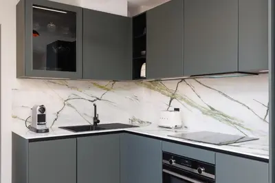 a kitchen with gray cabinets and a sink at Sublime appartement Forville Festival in Cannes