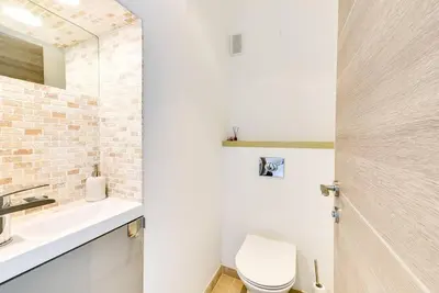 a bathroom with a white toilet and a sink at Immogroom- 2 bedrooms -Panoramic Sea view - Huge in Cannes