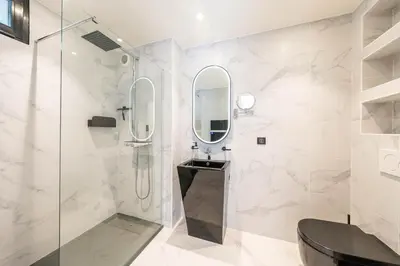 a bathroom with a shower and a mirror at Luxury Villa Cannes,350 m2, 12 pers, 6 ch 6 sdb in Cannes