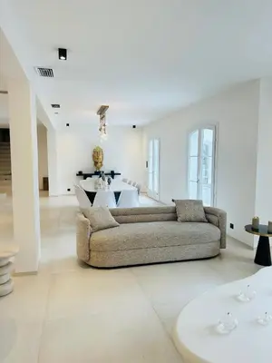 a living room with a couch and a table at Luxury Villa Cannes,350 m2, 12 pers, 6 ch 6 sdb in Cannes