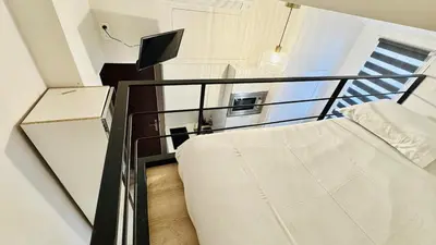 a small room with a bed and a window at Croisette Studio, Palais des Festivals and Beach in Cannes