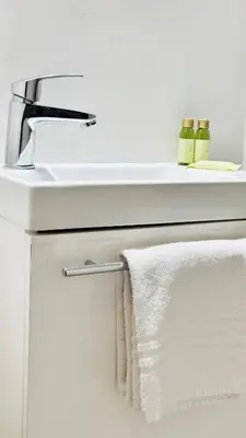 a bathroom sink with a white towel hanging from it at Croisette Studio, Palais des Festivals and Beach in Cannes