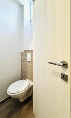 a bathroom with a white toilet and a window at Croisette Studio, Palais des Festivals and Beach in Cannes