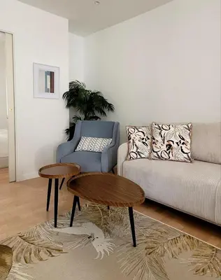 a living room with a couch and a table at Newly renovated 3-rooms apartment in the heart of old Cannes, up to 6 persons in Cannes