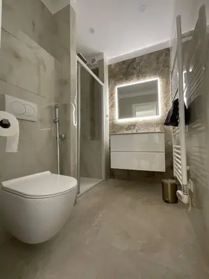 a bathroom with a toilet and a shower and a sink at Newly renovated 3-rooms apartment in the heart of old Cannes, up to 6 persons in Cannes