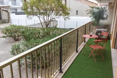 a balcony with a table and chairs on it at Le Vendôme - Hypercentre - AC - Terrace - Palais of Festivals - Croisette in Cannes