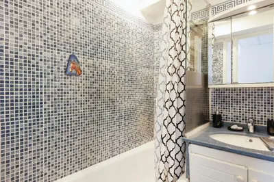 a bathroom with a sink and a shower at Cannes Beach - Vue Mer-Plage-Piscine-Clim-Wifi in Cannes
