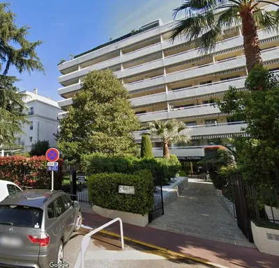 a car parked in front of a large building at Studio Victoria 200 m Carlton Hotel & Croisette in Cannes