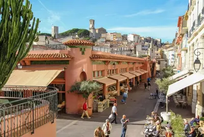 a group of people walking down a city street at Studio Victoria 200 m Carlton Hotel & Croisette in Cannes