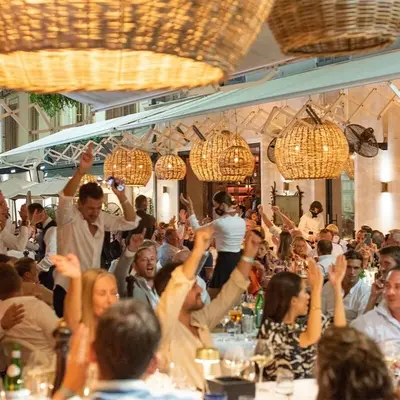 a group of people with their hands in the air at Studio Victoria 200 m Carlton Hotel & Croisette in Cannes