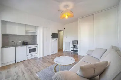 a living room with a couch and a table at Lumineux studio LOGGIA, Alexandre III- proche CROISETTE A0B203 in Cannes
