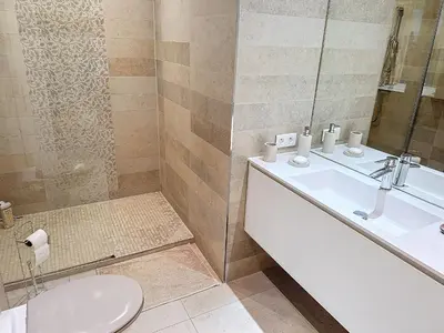 a bathroom with a toilet and a sink at A deux pas des plages piscine 346L FRANCHI in Cannes