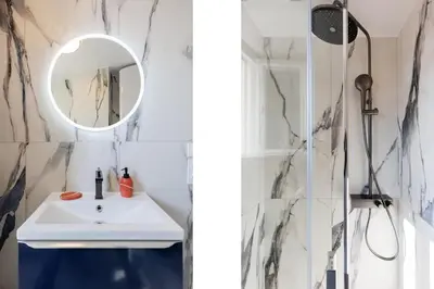 a room with a blue refrigerator next to a bed at 