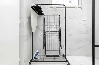 a towel rack in a bathroom with a shower at Le Maubourg - Cannes terrasse near Beaches in Cannes