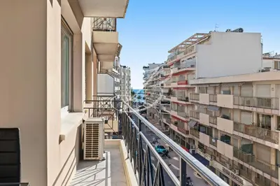 an apartment balcony with a view of a street at Le Maubourg - Cannes terrasse near Beaches in Cannes