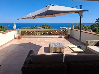 a balcony with a view of the ocean at Villa Roxane in Vallauris
