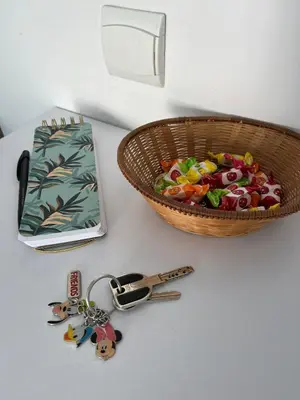 a basket of food next to a basket of keys at Studio centre Cannes, piscine, climatisation in Cannes
