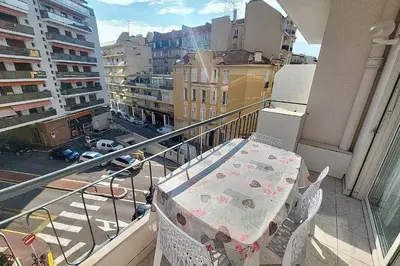 a balcony with a bed on top of a balcony at AHC - Versailles- 2 pièces centre ville in Cannes