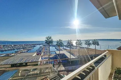 a view of a marina with boats in the water at Henri Camille Agency - Le Cap - 2 bedrooms Apt sea view in Cannes
