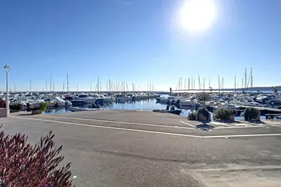 a marina with a bunch of boats in the water at Henri Camille Agency - Le Cap - 2 bedrooms Apt sea view in Cannes