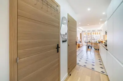 a wooden door in a kitchen with a dining room at Cannes centre derrière le Martinez in Cannes