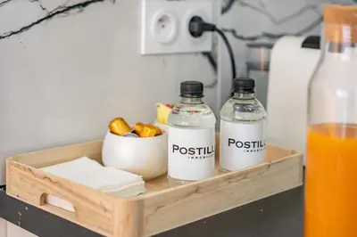 a wooden tray with two bottles of water and orange juice at Cannes centre derrière le Martinez in Cannes