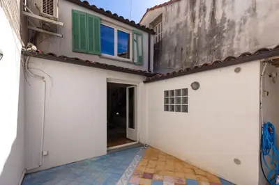 an alley in a building with a door and a window at Cannes Loft 1 bedroom - 3R in Cannes