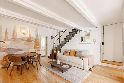 a living room with a couch and a table at Cannes Loft 1 bedroom - 3R in Cannes