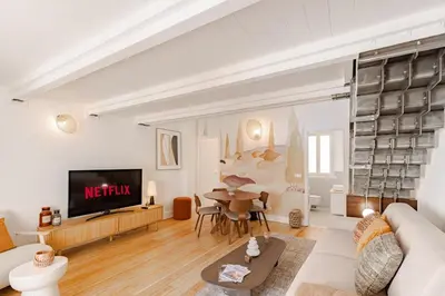 a living room with a couch and a table at Cannes Loft 1 bedroom - 3R in Cannes