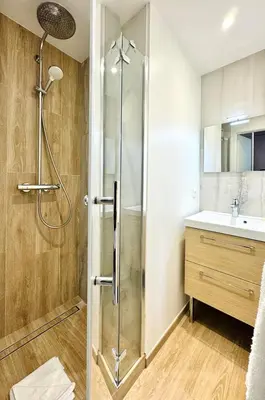 a bathroom with a shower and a sink at Cozy Croisette Retreat Cannes in Cannes