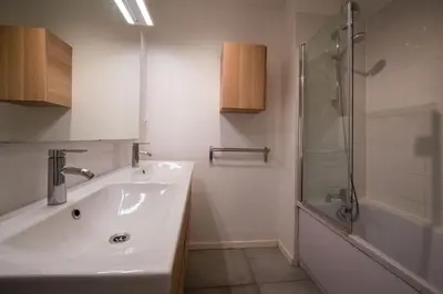 a bathroom with a sink and a shower at Évasion Pointe Croisette, vue mer, plage à une minute in Cannes