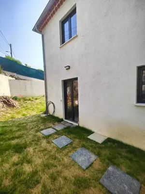a house with stepping stones in the grass at studio la mimosette in Cannes