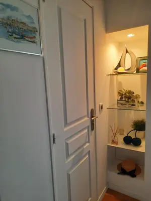 an open door in a room with a shelf at One bedroom apartment Palm Beach in Cannes