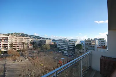 a view of a city from a balcony at One bedroom apartment Palm Beach in Cannes