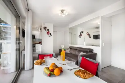 a white table with food on it in a living room at Charmant Studio - Calme - Croisette & Plage à 7 min in Cannes