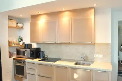 a kitchen with a sink and a microwave at Charming Apartment Cannes City Center and Beaches in Cannes