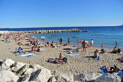 a large group of people on a beach at Cannes - Centre- Film Festival in Cannes