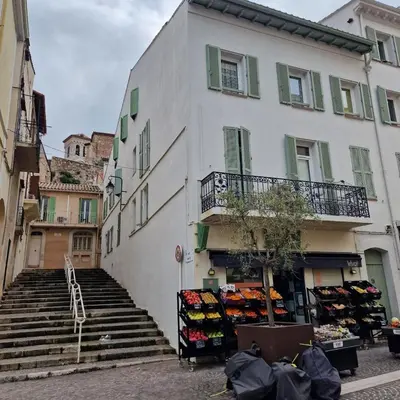 a white building with stairs in front of a store at Cannes - Centre- Film Festival in Cannes