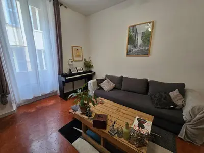a living room with a couch and a coffee table at Cannes - Centre- Film Festival in Cannes