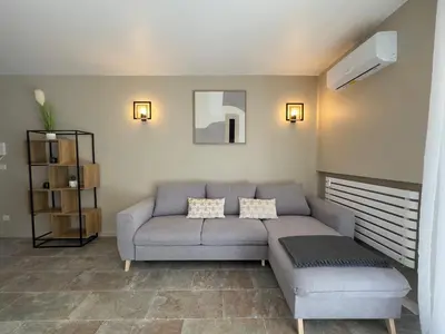 a living room with a couch and a table at COSY CASTILLE - Proche de la CROISETTE in Cannes