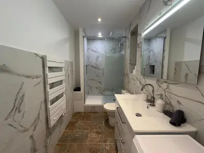 a bathroom with a sink and a toilet and a shower at COSY CASTILLE - Proche de la CROISETTE in Cannes