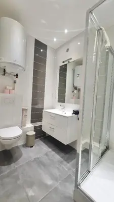 a bathroom with a toilet and a sink and a shower at Cannes 1-Bedroom Apartment - 15M in Cannes