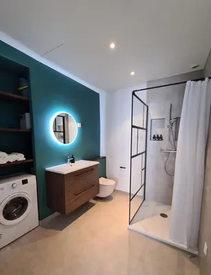 a bathroom with a shower and a washing machine at 2 Bedrooms 5 min walk to Croisette in Cannes