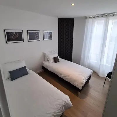 a bedroom with two beds and a window at 2 Bedrooms 5 min walk to Croisette in Cannes
