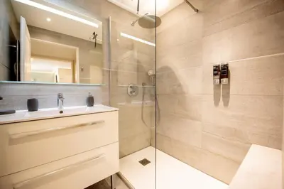 a bathroom with a shower and a sink at Sunny Palazzio T3 Old Port, Beaches, Congress in Cannes